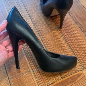 Black leather pumps